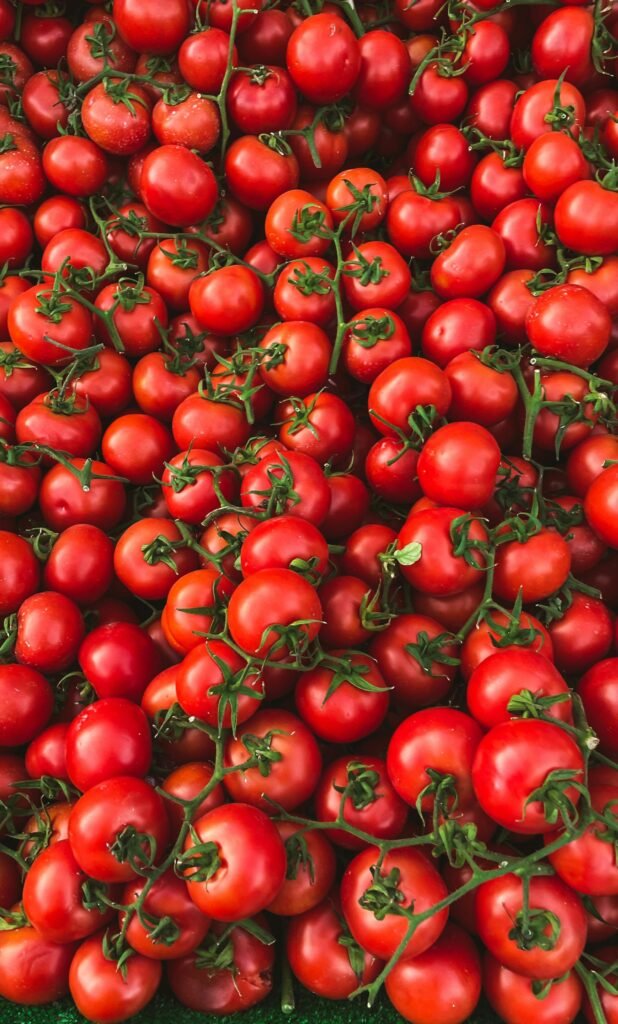 A vibrant display of fresh red tomatoes at a market in Istanbul, Türkiye. Perfect for farm-to-table visuals.